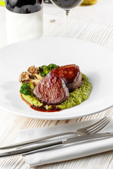 Grilled steak delicious beef meat on a white plate on a light background menu