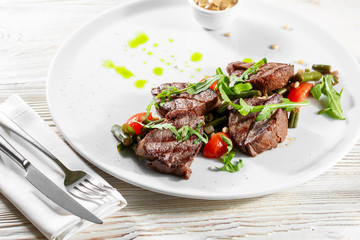 Grilled steak delicious beef meat on a white plate on a light background menu
