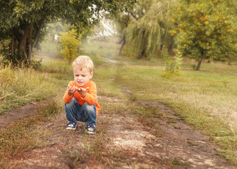 The dirty hands of a little boy who has been playing .