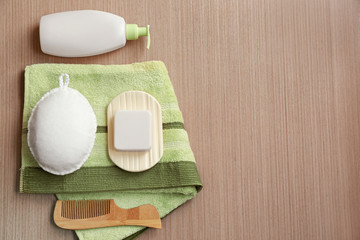 Beautiful composition with cosmetics and bath accessories on wooden background