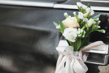 Beautiful floral decoration on wedding car, closeup
