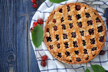 Tasty cherry pie on wooden table
