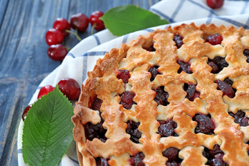 Tasty cherry pie on wooden table, closeup