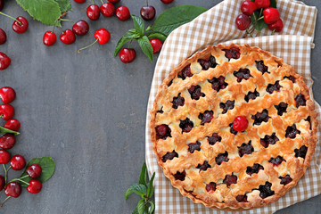 Composition with tasty cherry pie on gray table