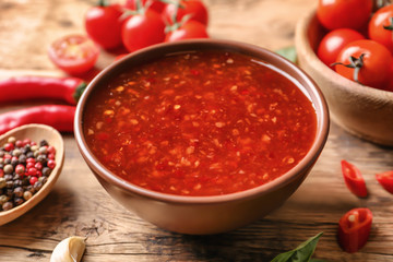 Chili sauce in bowl on table
