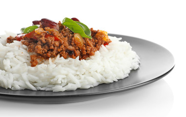 Chili con carne served with rice on plate against white background