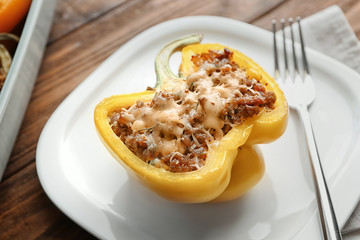 Quinoa stuffed pepper on white plate