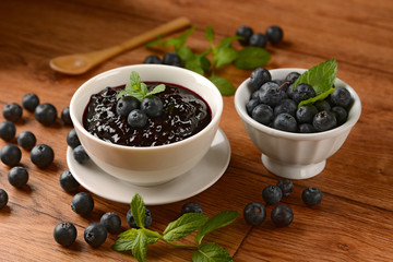 homemade blueberry jam with fruits around