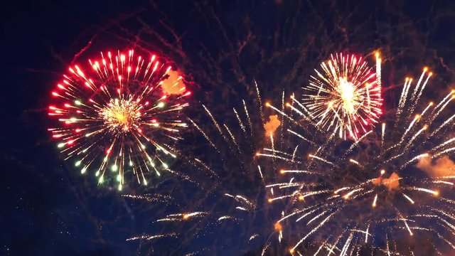 Beautiful colorful fireworks show in the night sky, 4k
