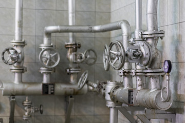 Handle valve with steel pipe in industrial plant.