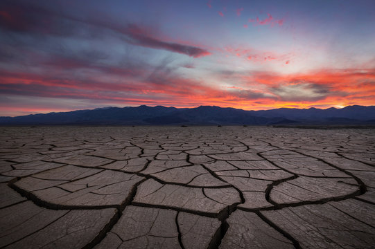 Beautiful sunset with cracked and scorched foreground in Death Valley
