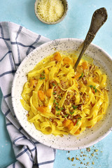 Tagliatelle with pumpkin in a cream sauce.Top view.