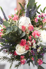 wedding colourful bouquet in bride's hands white background