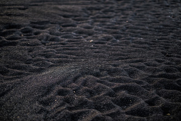 Volcanic rock on black sand beach at Vik in southern Iceland