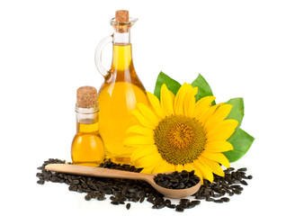 Sunflower oil, seeds and flower isolated on white background