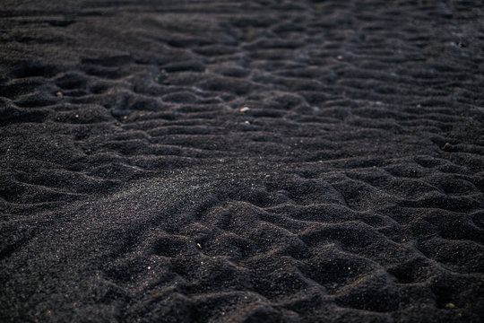 Volcanic rock on black sand beach at Vik in southern Iceland