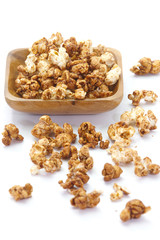 Close - up Caramel chocolate popcorn on white background