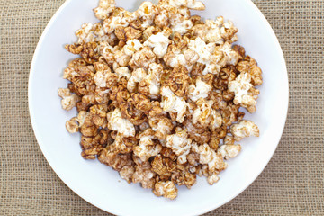 Close - up Caramel chocolate popcorn in white plate