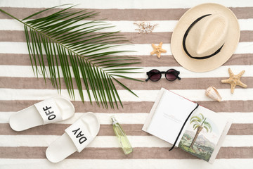 Beach items on a striped towel