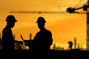 Silhouette images of construction sites are underway and workers are working - Powered by Adobe