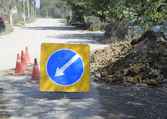 Sign of detour travel. Pit on the road. repair work.