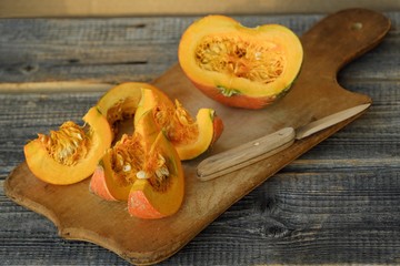 Delicious fresh orange pumpkin on wooden table