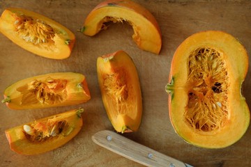 Delicious fresh orange pumpkin on wooden table