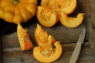 Delicious fresh orange pumpkin on wooden table 