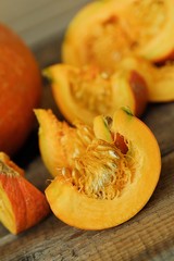 Delicious fresh orange pumpkin on wooden table 