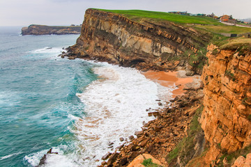 Cliffs of Suances at sunset , which stretches around the confluence of the rivers Saja and Besaya....
