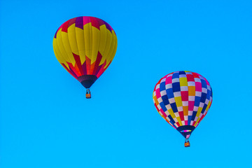 Naklejka premium Two Multi Colored Hot Air Balloons