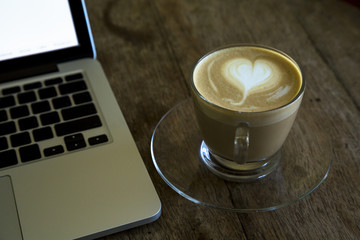 latte coffee on wood table.