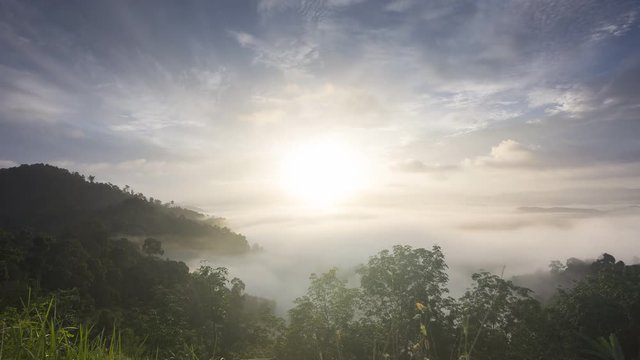 4K Time lapse , The movement of fog over the mountains. on the mornning with sunrise.
