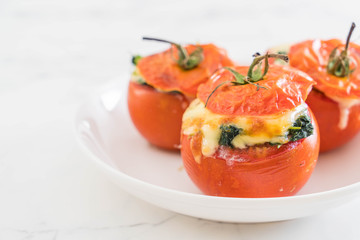  baked tomatoes stuffed with cheese and spinach