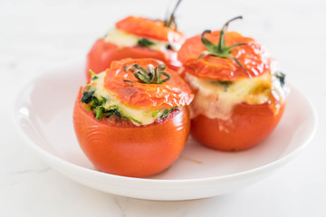  baked tomatoes stuffed with cheese and spinach