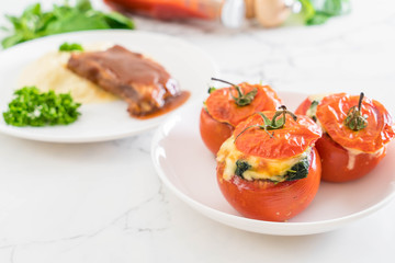  baked tomatoes stuffed with cheese and spinach
