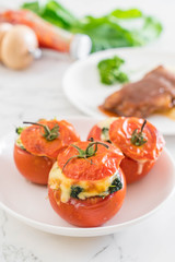  baked tomatoes stuffed with cheese and spinach
