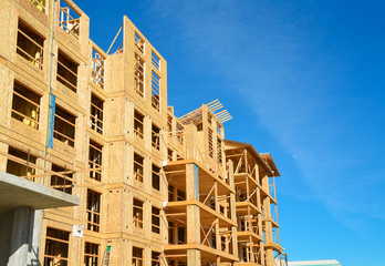 New low-rise building under construction on sunny day in British Columbia, Canada