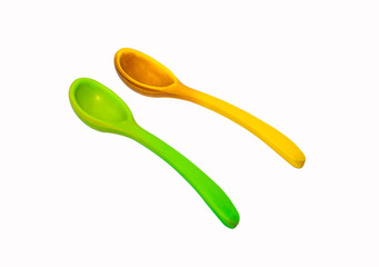 old Plastic spoons Green and yellow isolated on white background