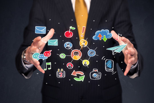 Businessman holding colorful applications