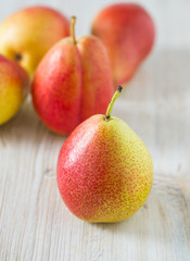 beautiful ripe pears on wooden surface