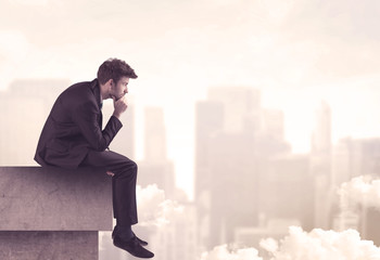 Peaceful sales guy sitting on roof top