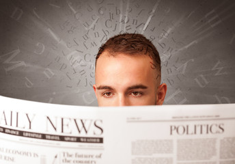 Businessman reading newspaper