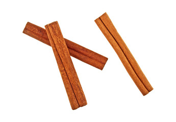Top view of cinnamon sticks isolated over white background