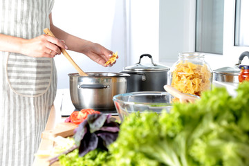 Fresh vegetables on the cutting board, salad in a glass dish. Concept of cooking