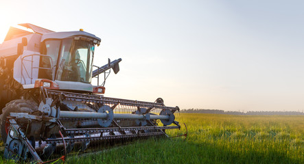 Photo of combine harvester working in field