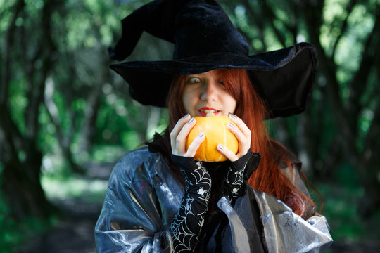 Picture of young witch with pumpkin