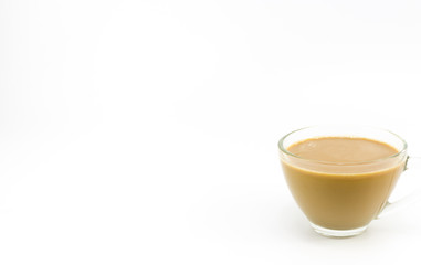 The milk coffee in a transparent glass