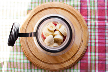 Closeup preparation of strawberry and banana smoothie