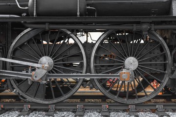 Fototapeta na wymiar Wheels of an old locomotive